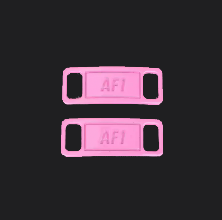 The image is featuring a pair of pink shoe tags on a blank black background. The air force 1 shoes tags are for sneaker laces and come in pairs. 