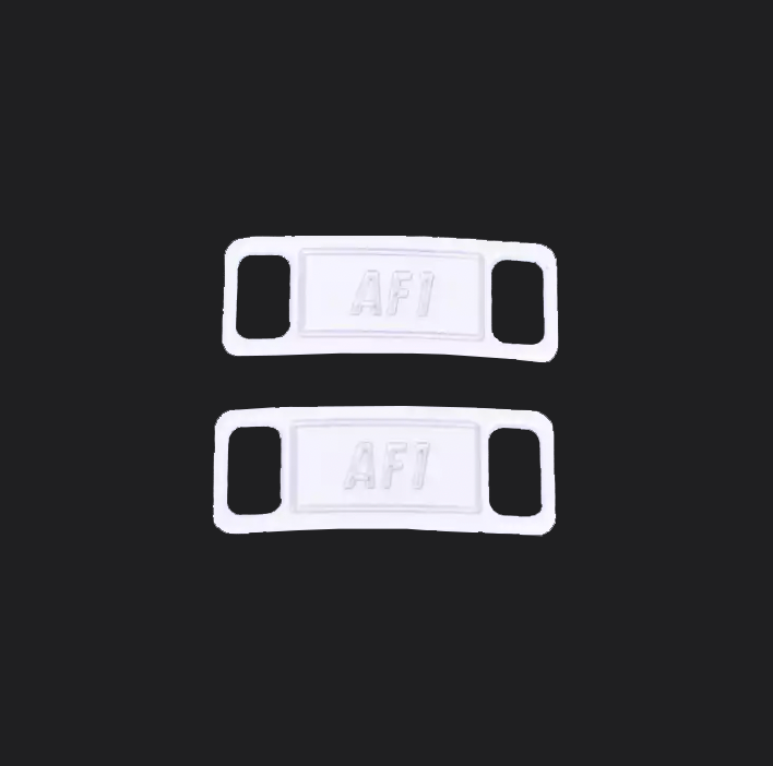 The image is featuring a pair of white shoe tags on a blank black background. The air force 1 shoes tags are for sneaker laces and come in pairs. 